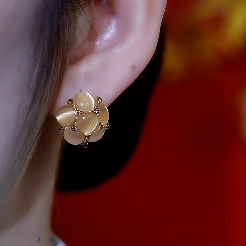 Close-up detail of the sparkling zircons and plating on the Cat's Eye Earrings