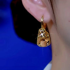 Close-up detail of the sparkling zircons and plating on the Cat's Eye Stone Earrings