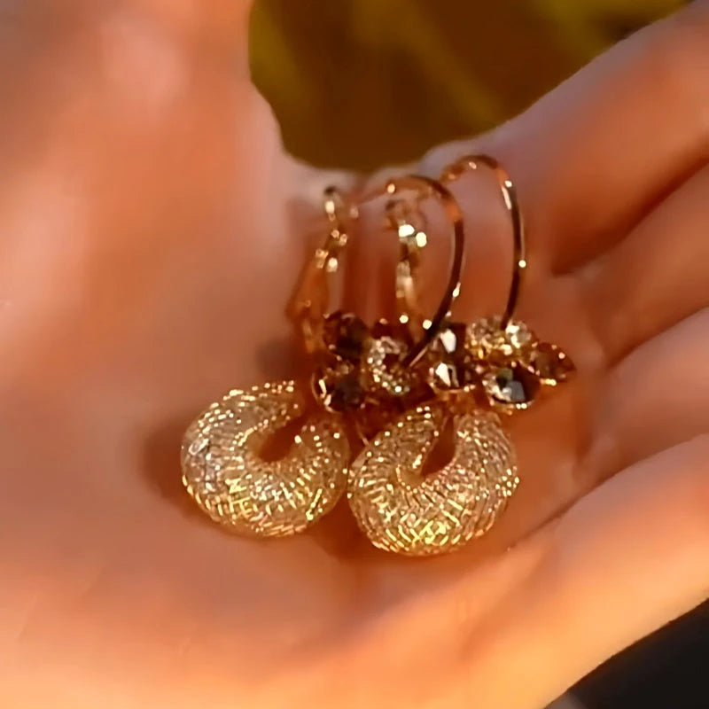 Close-up detail of the sparkling zircons and plating on the Flower Mesh Earrings