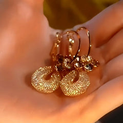 Close-up detail of the sparkling zircons and plating on the Flower Mesh Earrings