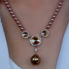 Close-up of the pendant and clasp on the Sunflower Necklace