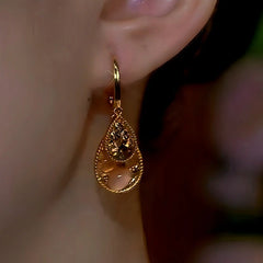 Close-up detail of the sparkling zircons and plating on the Brown Water Drop Earrings