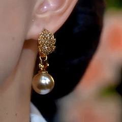 Close-up detail of the sparkling zircons and plating on the Pearl Leaf Earrings