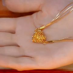 Close-up of the pendant and clasp on the Magnetic Heart Necklace