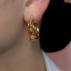 Alternate side view of layered gold opal crystal hoop earring on ear
