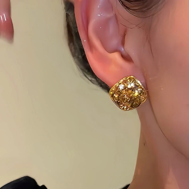 Close-up detail of the sparkling zircons and plating on the Zircon Stud Earrings