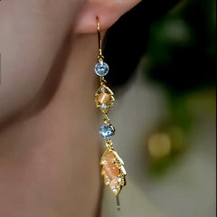 Close-up detail of the sparkling zircons and plating on the Leaf Threader Earrings