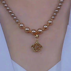 Close-up of the pendant and clasp on the Ginkgo Leaf Necklace