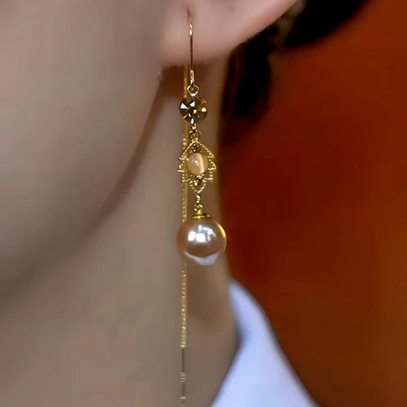 Close-up detail of the sparkling zircons and plating on the Leaf Threader Earrings