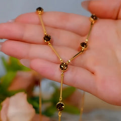 14K Gold-Plated Brown Zircon Necklace worn to showcase its length and pendant detail