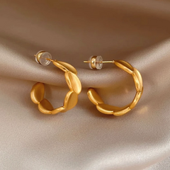 Angled view of the 14K Gold-Plated Brushed C-Shaped Earrings