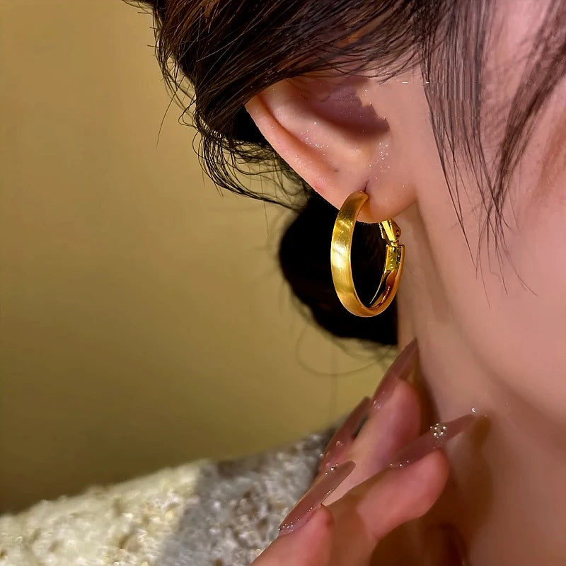 Close-up detail of the sparkling zircons and plating on the Brushed Hoop Earrings