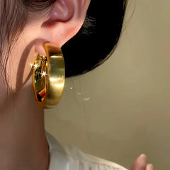 Close-up detail of the sparkling zircons and plating on the Brushed Hoop Earrings