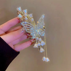 Angled view of the stylish 14K Gold-Plated Butterfly Flower Tassel Hair Clip
