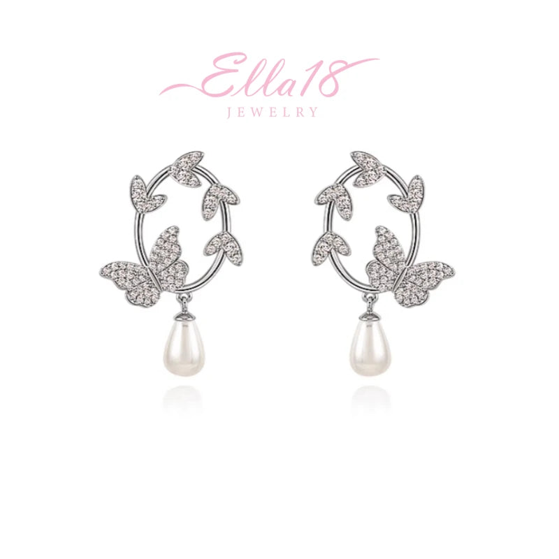 Angled view of the 14K Gold-Plated Butterfly Pearl Earrings