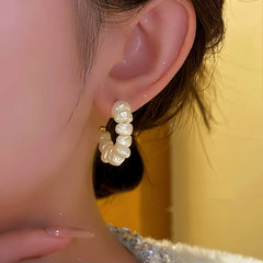 Model showcasing the dangle and style of the 14K Gold-Plated C-Shaped Bead Earrings