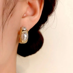 Close-up detail of the sparkling zircons and plating on the C-Shaped Pearl Earrings