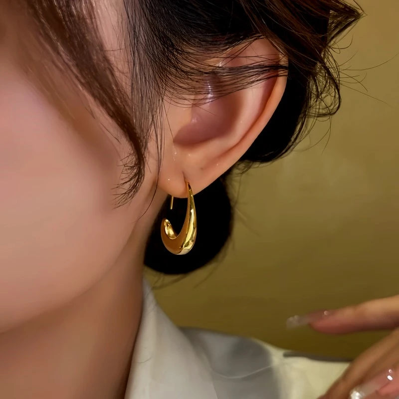 Close-up detail of the sparkling zircons and plating on the C-Shaped Threader Earrings