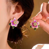 Gold Tone Pink Purple Crystal Flower Stud Earrings on Ear, Hand Held Display