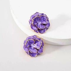 Close-up detail of the sparkling zircons and plating on the Camellia Flower Studs