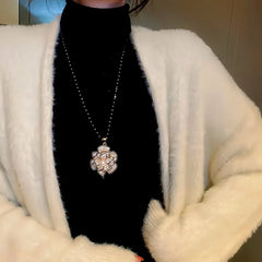 14K Gold-Plated Camellia Sweater Chain With Diamond Necklace worn to showcase its length and pendant detail