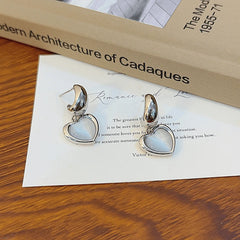 Angled view of the 14K Gold-Plated Cat Stone Heart Earrings