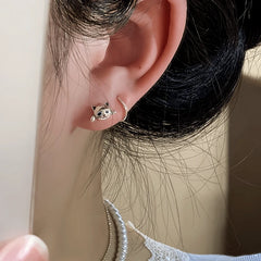 Close-up detail of the sparkling zircons and plating on the Cat Earrings