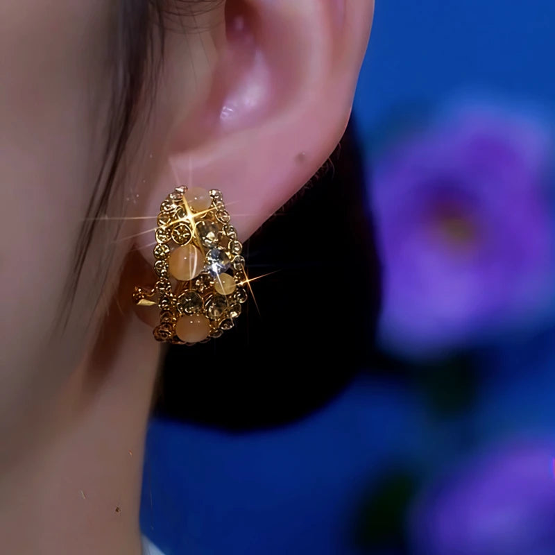 Close-up detail of the sparkling zircons and plating on the Cat's Eye Earrings