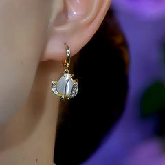 Close-up detail of the sparkling zircons and plating on the Cat's Eye Flower Earrings