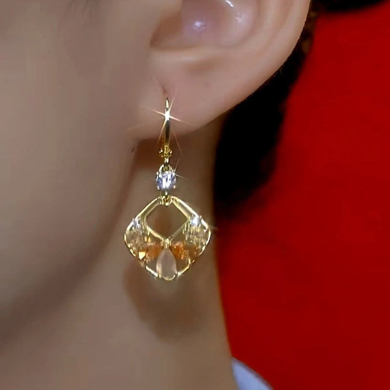 Close-up detail of the sparkling zircons and plating on the Geometric Square Earrings