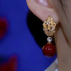 Close-up detail of the sparkling zircons and plating on the Pearl Leaf Earrings