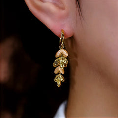 Close-up detail of the sparkling zircons and plating on the Leaf Tassel Earrings