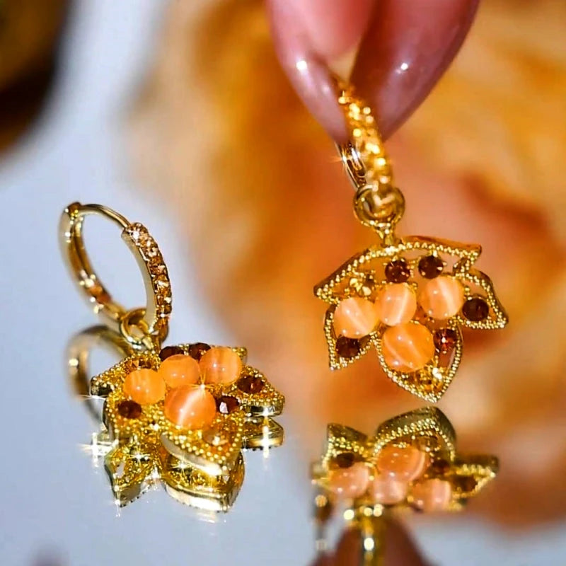 Close-up detail of the sparkling zircons and plating on the Maple Leaf Earrings