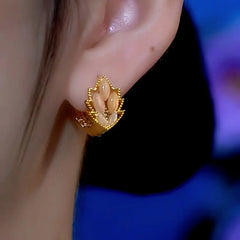 Close-up detail of the sparkling zircons and plating on the Maple Leaf Earrings