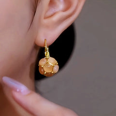 Close-up detail of the sparkling zircons and plating on the Cat's Eye Stone Earrings