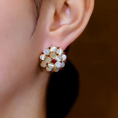 Close-up detail of the sparkling zircons and plating on the Flower Stud Earrings
