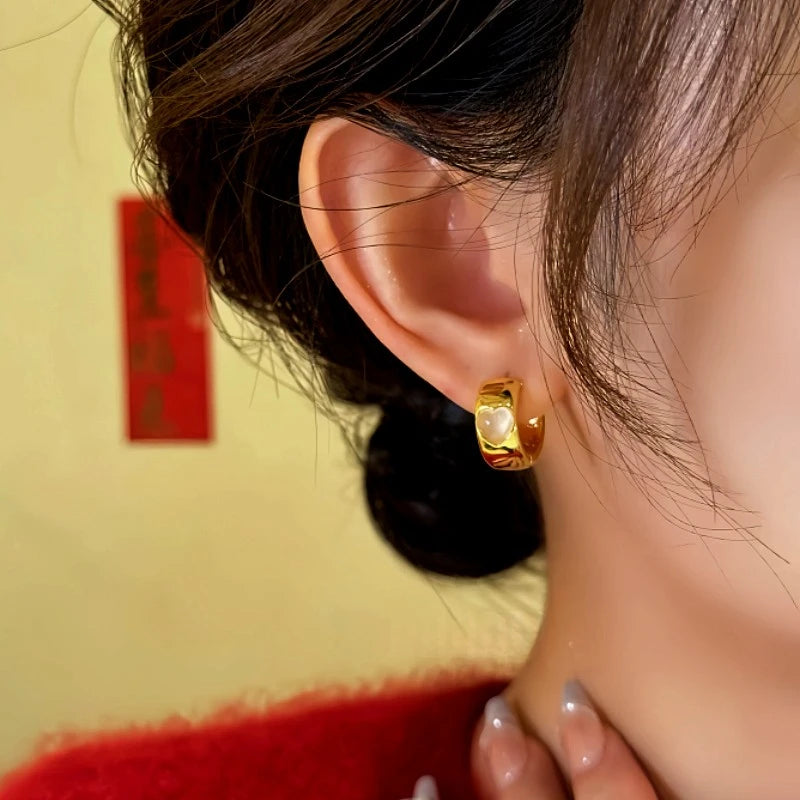 Close-up detail of the sparkling zircons and plating on the Cat's Eye Hoop Earrings