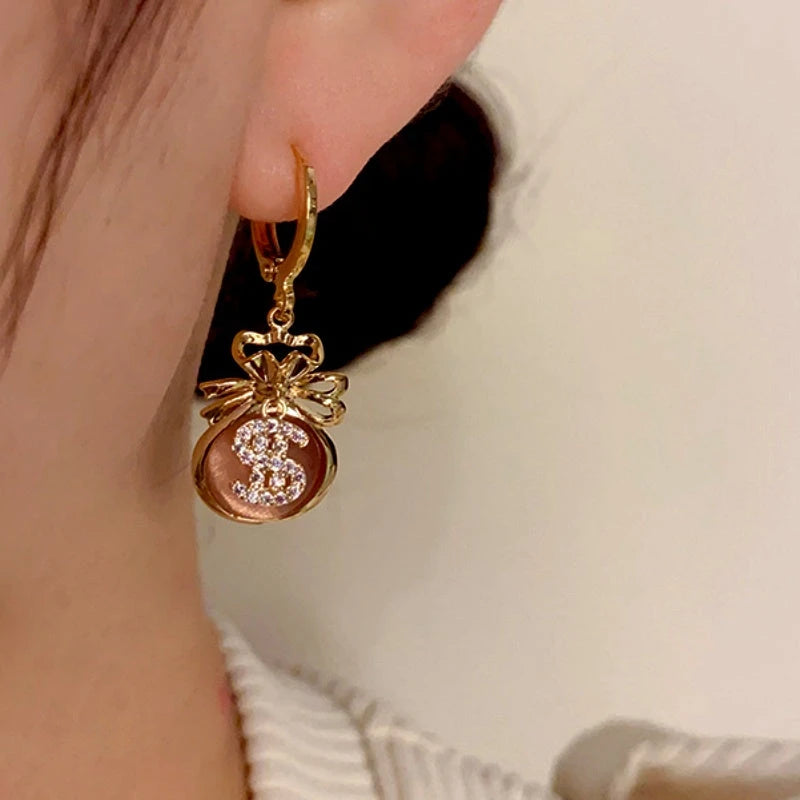 Close-up detail of the sparkling zircons and plating on the Lucky Bag Earrings