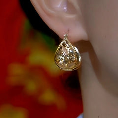 Close-up detail of the sparkling zircons and plating on the Water Drop Earrings