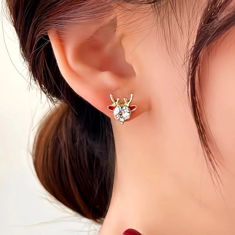 Model showcasing the dangle and style of the 14K Gold-Plated Christmas Asymmetrical Deer Earrings