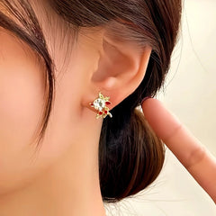 Angled view of the 14K Gold-Plated Christmas Asymmetrical Deer Earrings