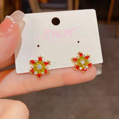 Angled view of the 14K Gold-Plated Christmas Full Diamond Snowflake Earrings