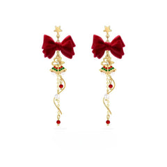 Model showcasing the dangle and style of the 14K Gold-Plated Christmas Gift Bell Earrings