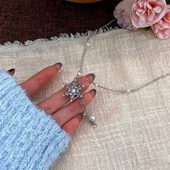 Close-up of the pendant and clasp on the Snowflake Tassel Necklace