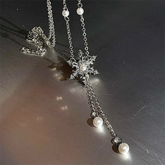 Detailed view of the 14K Gold-Plated Christmas Snowflake Pearl Tassel Necklace chain and pendant
