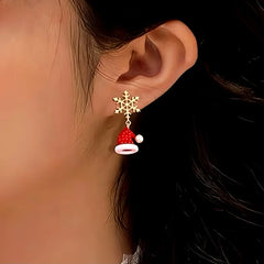 Model showcasing the dangle and style of the 14K Gold-Plated Christmas Snowflake Shoes Hat Earrings
