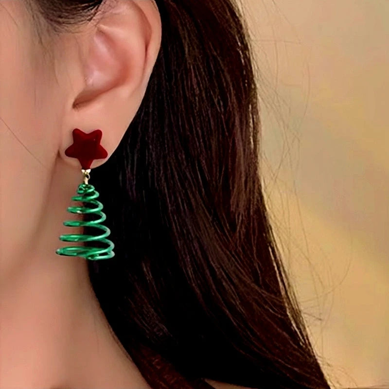 Model showcasing the dangle and style of the 14K Gold-Plated Christmas Tree Red Velvet Star Earrings