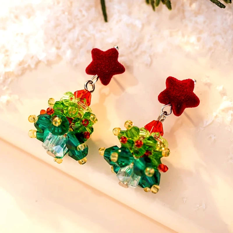 Angled view of the 14K Gold-Plated Christmas Tree Star Earrings