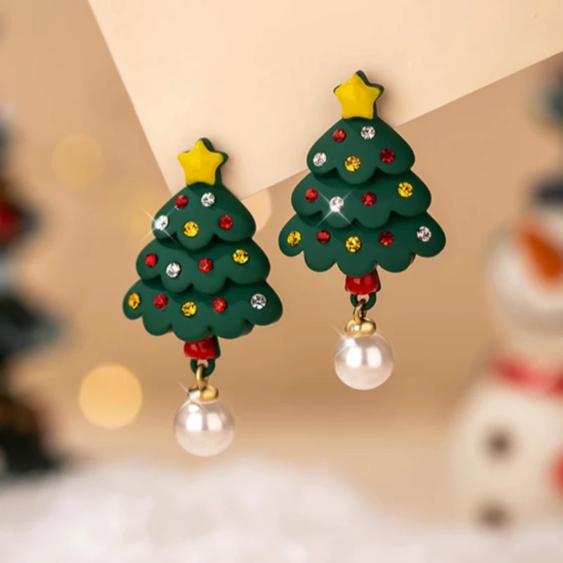 Model showcasing the dangle and style of the 14K Gold-Plated Christmas Tree Star Pearl Earrings