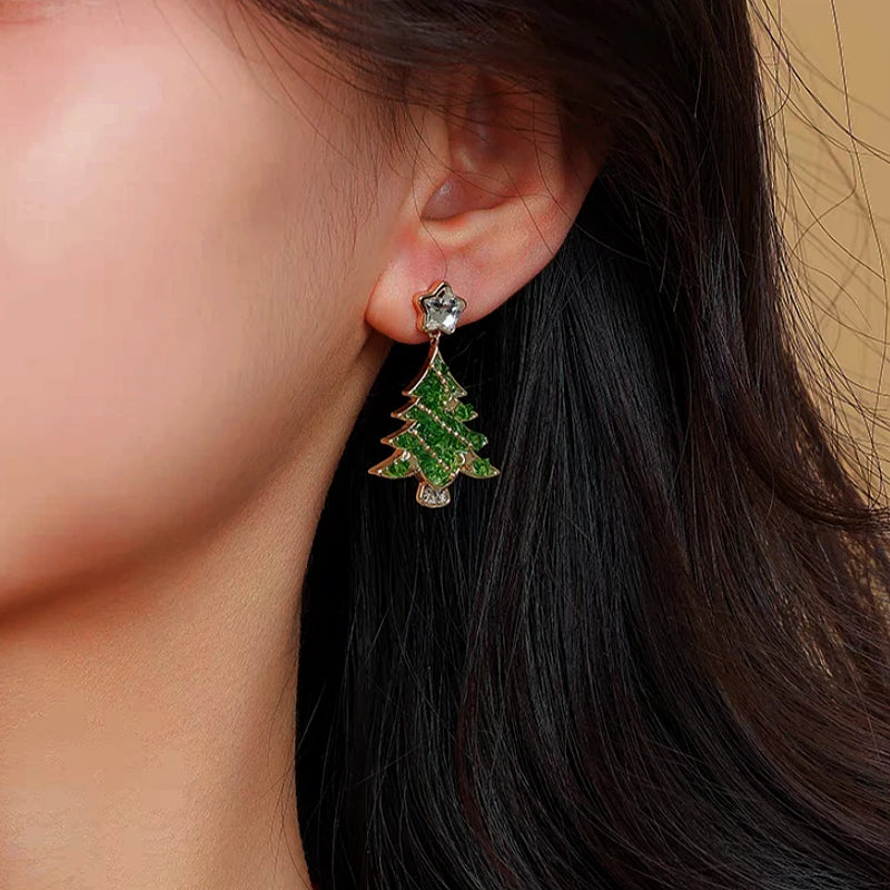 Model showcasing the dangle and style of the 14K Gold-Plated Christmas Tree Zircon Star Earrings